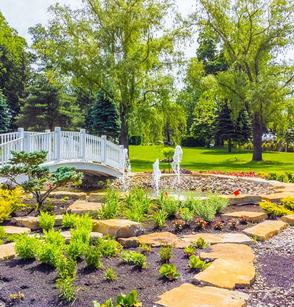 Open area with bridge pond at Chateau Vaudreuil