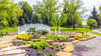 Open area with bridge pond at Chateau Vaudreuil