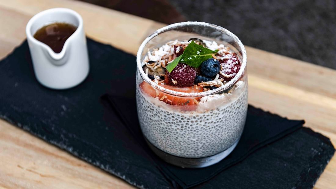 Chia pudding topped with fresh berries and a mint leaf served for Breakfast at Ternary in Novotel Sydney on Darling Harbour