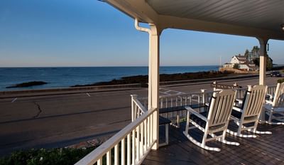 Hotel Exterior with porch and water view