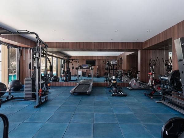 Spacious gym with treadmills and gym machines at Warwick Hotel Al Taif