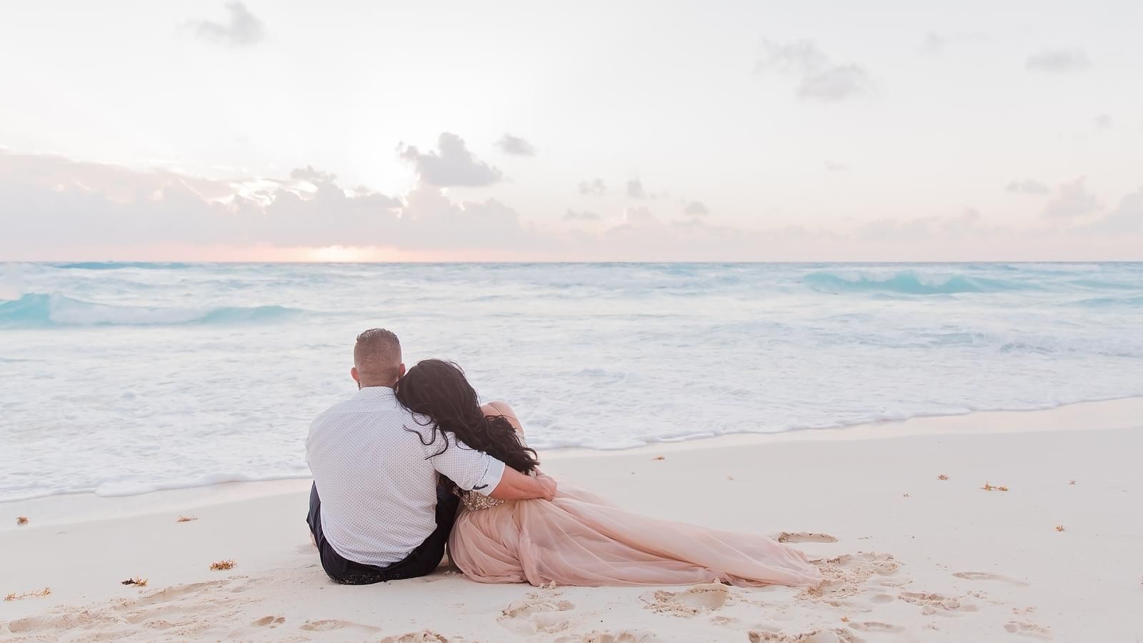 Couple watching over the sea from beach at FA Acapulco Villas