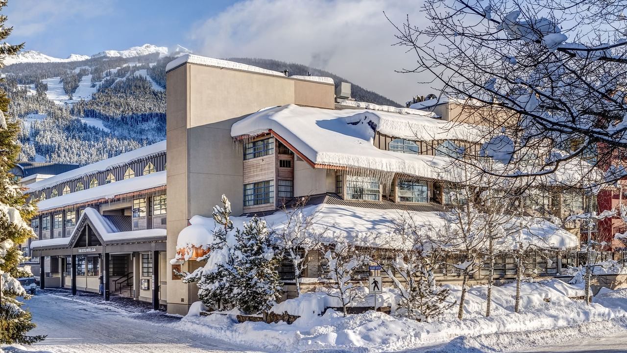 Listel Whistler, a Coast Hotel, hotel exterior during winter