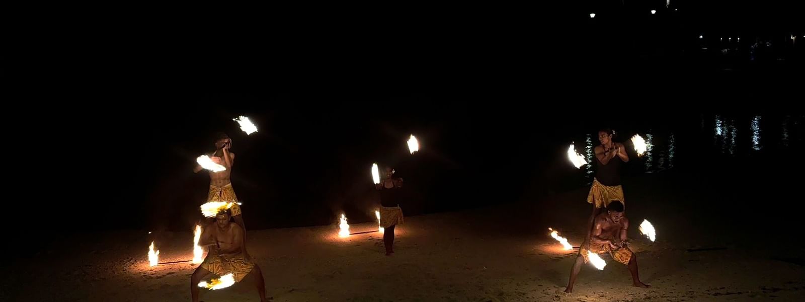 Performers doing a fire dance on the beach at Warwick Fiji Resort and Spa in Korolevu
