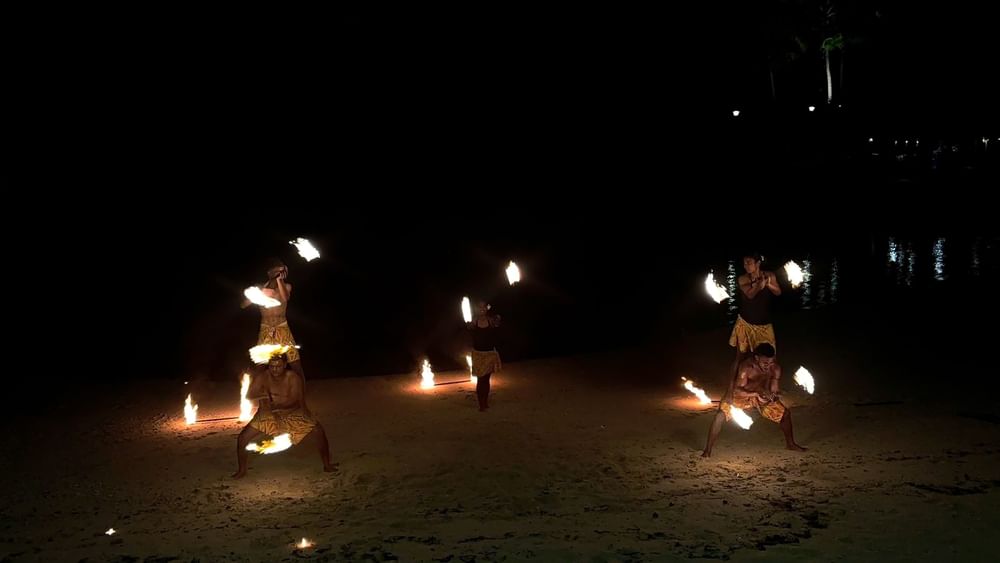 Performers doing a fire dance on the beach at Warwick Fiji Resort and Spa in Korolevu.