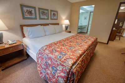 Bed area view of the room at Sophie Station Suites 