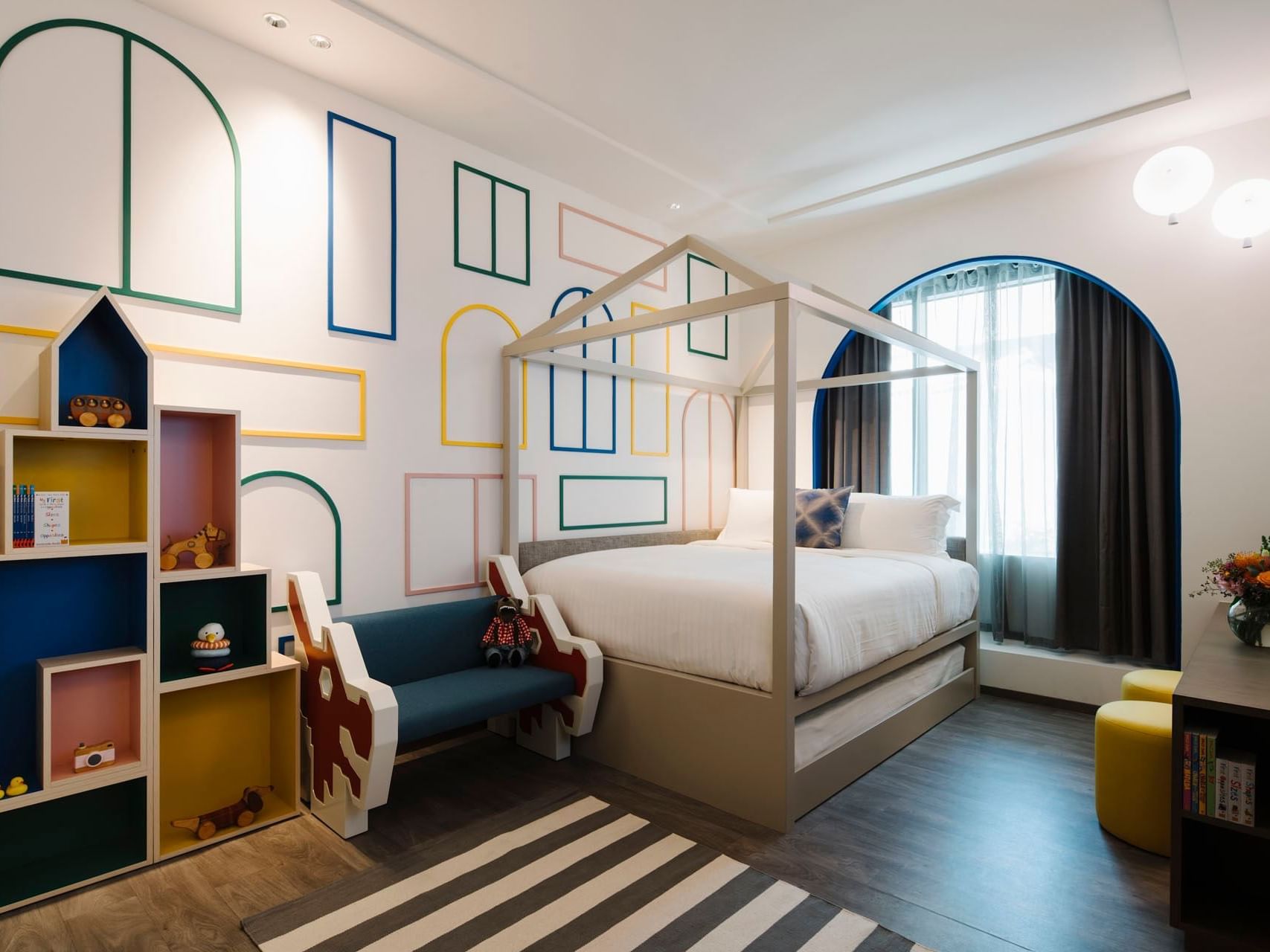 Child-friendly bedroom with a house-shaped bookshelf in Family Suite at Grand Park City Hall