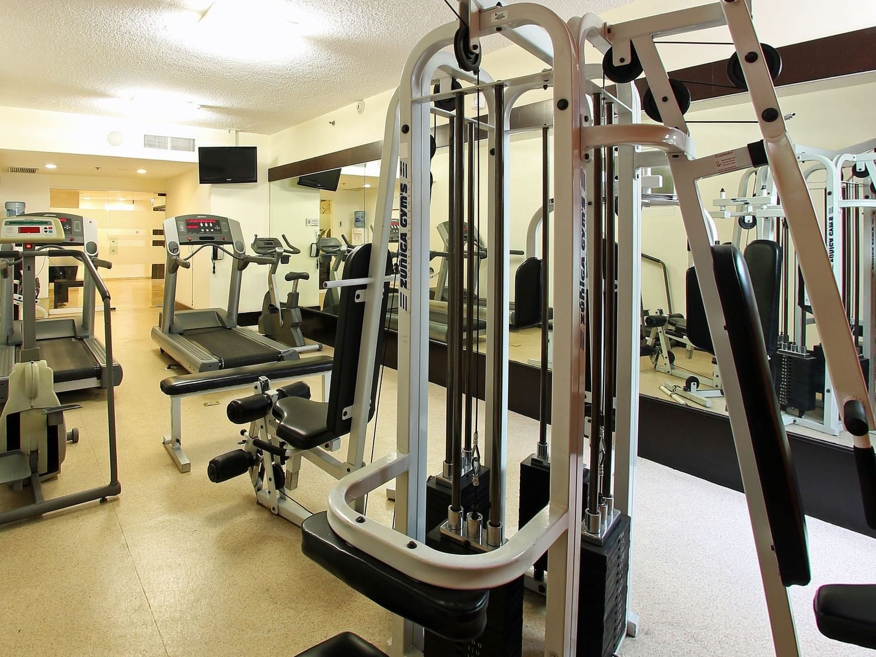 Exercise machines in a Gym Wellness Center at Fiesta Inn Hotels
