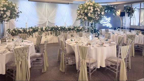 Well-arranged banquet tables for a wedding at Orsett Hall Hotel