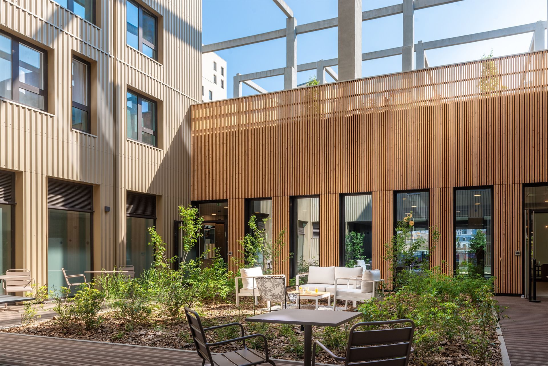 Lounges set up on the back patio at Residence Le Monde