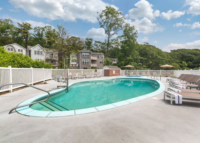 Outdoor swimming pool with pool beds at Ogunquit Collection