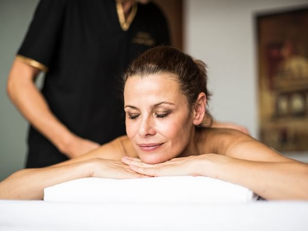 Close-up of a lady receiving a body massage at Liebes Rot Flueh