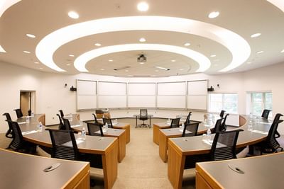 Amphitheater-style seating with tiered semicircular desks in Elm Room Amphitheatre at Spencer Hotel & Conference Centre