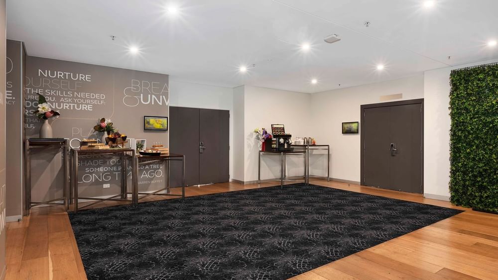 Pre-function area with modern decor and refreshments in The Yarra Room at Novotel Sydney on Darling Harbour