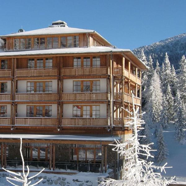 Wooden chalet in snowy mountainside at Falkensteiner Hotel Cristallo Katschberg