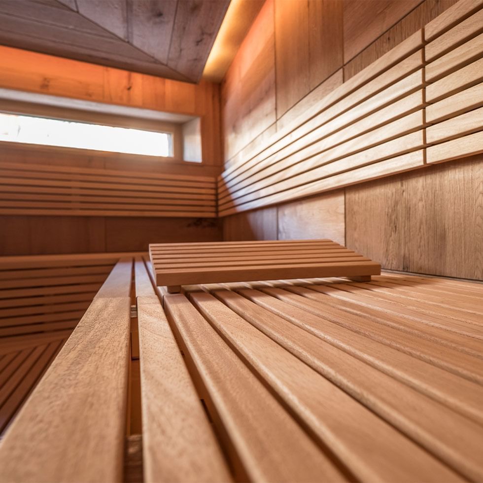 Close-up of a wooden sauna bench at Falkensteiner Hotels