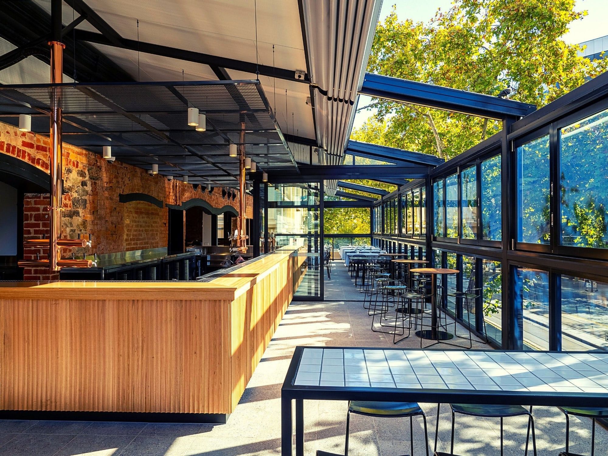 External Dinning area with tables & stools at Strathmore Hotel