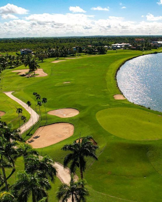 Aerial view La Estancia Golf Resort surrounded by lush greenery near The Hub Acunmeyda