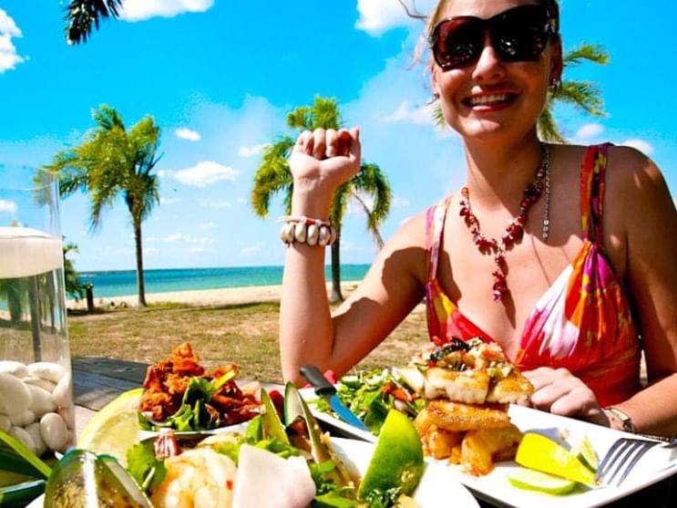 A girl dining in Crab Claw Island near H On Smith Hotel