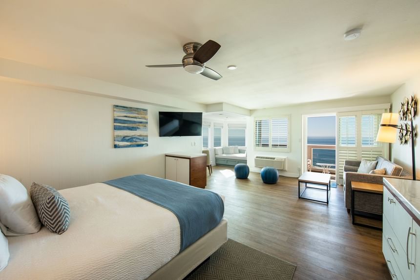 Hotel suite with one bed and couch 