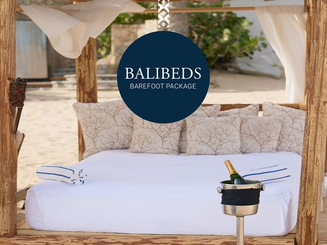 Cama de playa Balibeds con champán y vista al mar o piscina en el Hotel Hacienda del Mar en Los Cabos.
