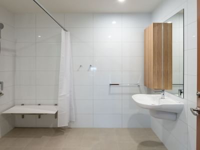 Clean and modern bathroom with shower and sink at UniLodge Brisbane City.