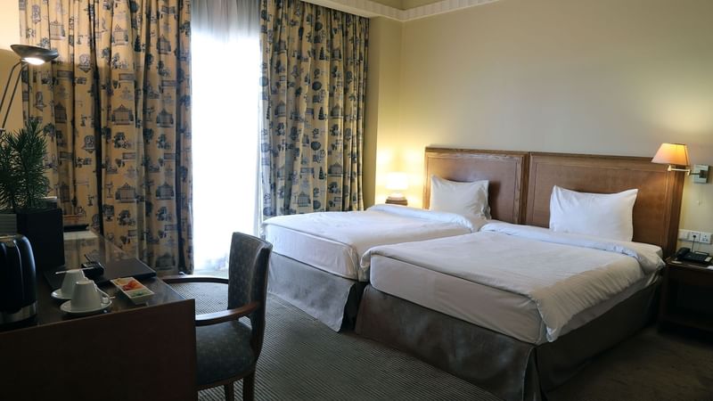 Work desk facing the beds in Classic Room Twin at Warwick Palm Beach Hotel - Beirut