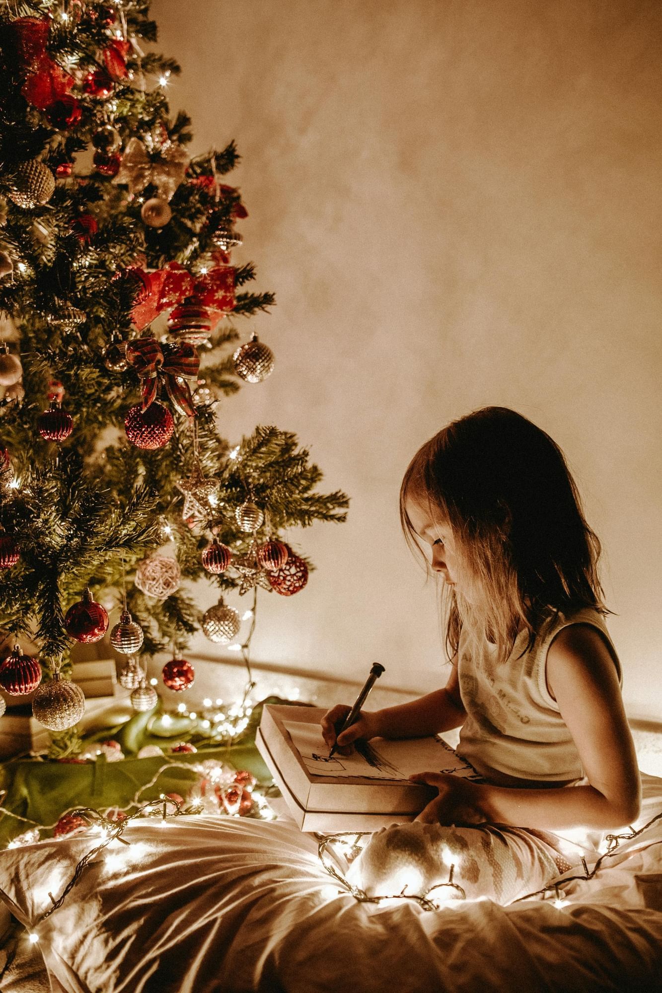 a girl writing in a book