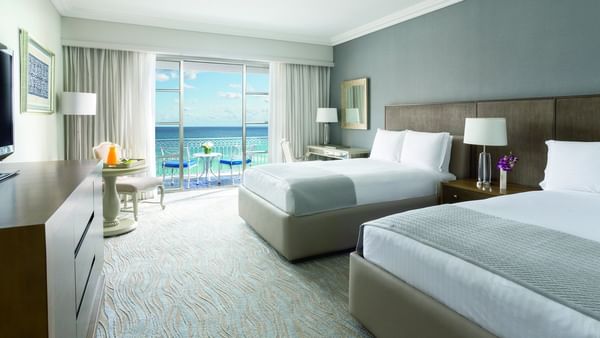 Side cupboard facing the beds in Deluxe Seafront Double Room with balcony at Kempinski Hotel Cancún