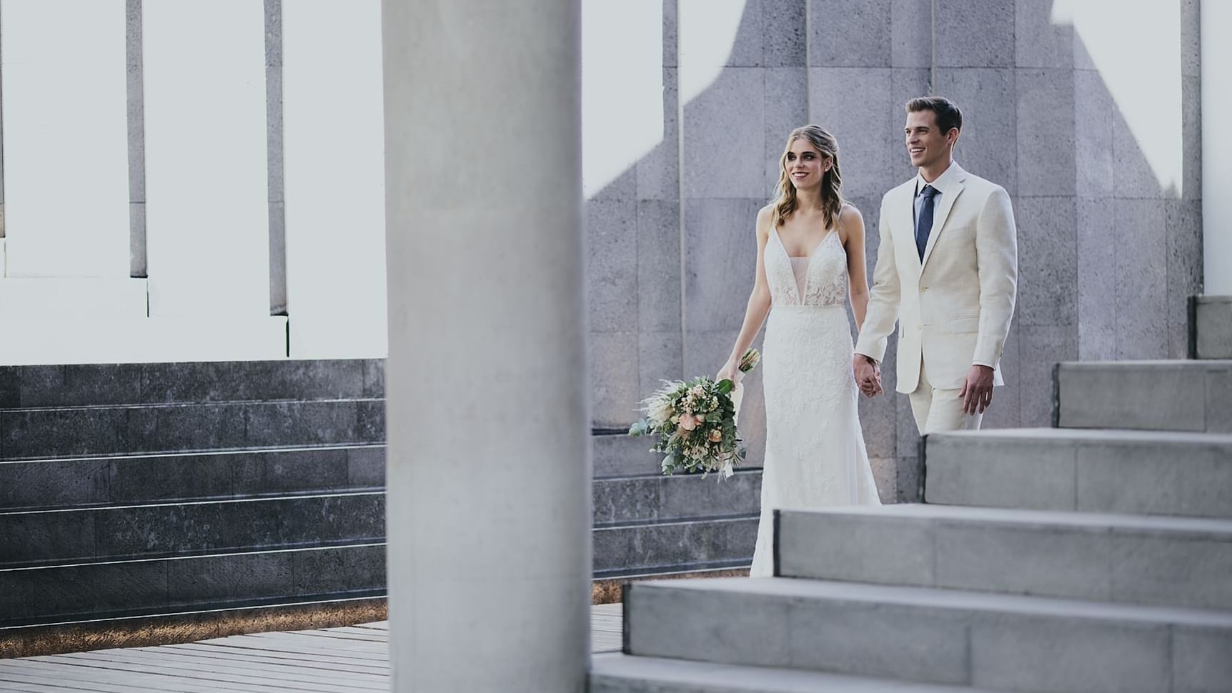 Couple walking by a stairway at Live Aqua Resorts