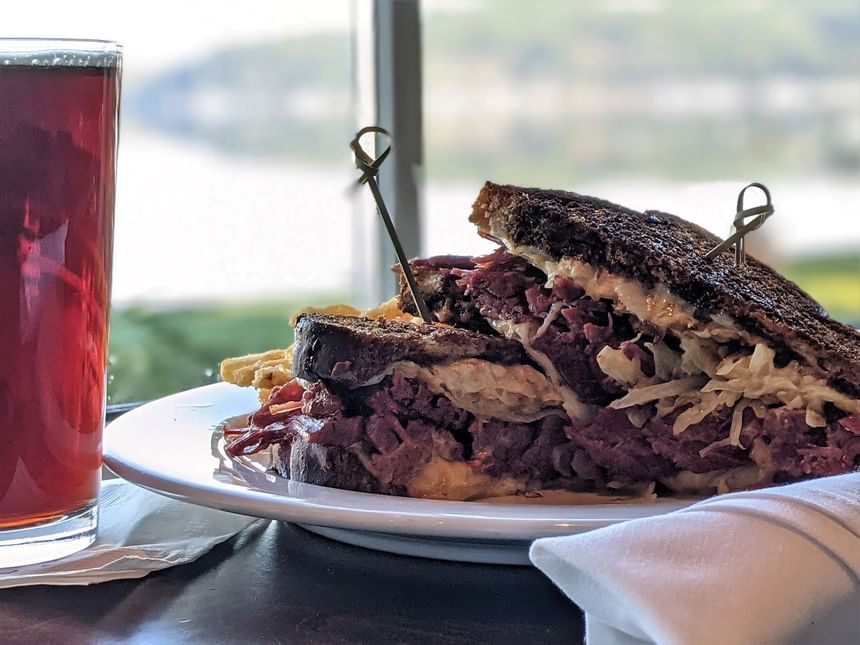 A sandwich dish served with a drink at Alderbrook Resort & Spa