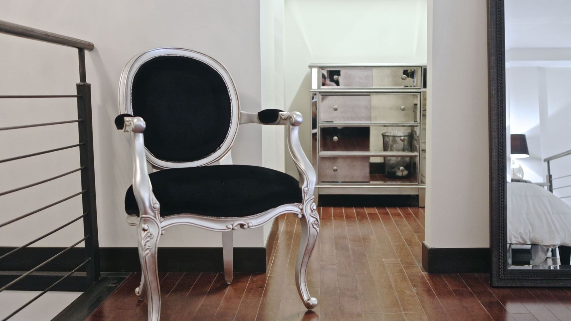 Royal chair near mirror in Loft Style Unit B at The Mayo Hotel