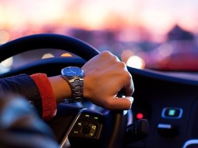 Close-up of hand on a car steering wheel at Hotel Grand Chancellor