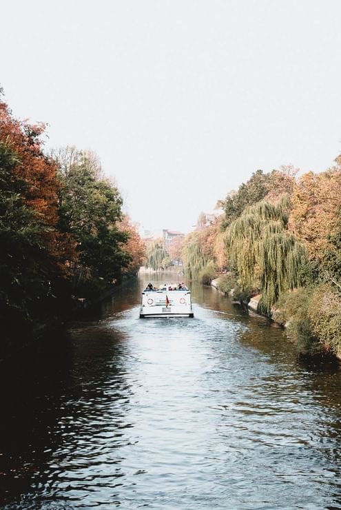 A boat in the middle of the river near the Hotel Berlin Berlin