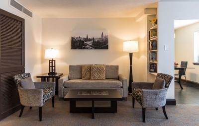 living room with sofa, accent chairs and coffee table