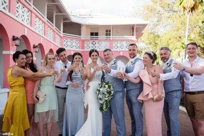 Newlywed couple & their family posing at Southern Palms Beach
