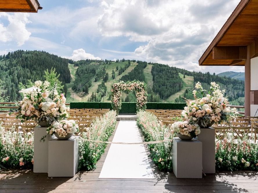Outdoor wedding ceremony setup on a deck at Stein Lodge