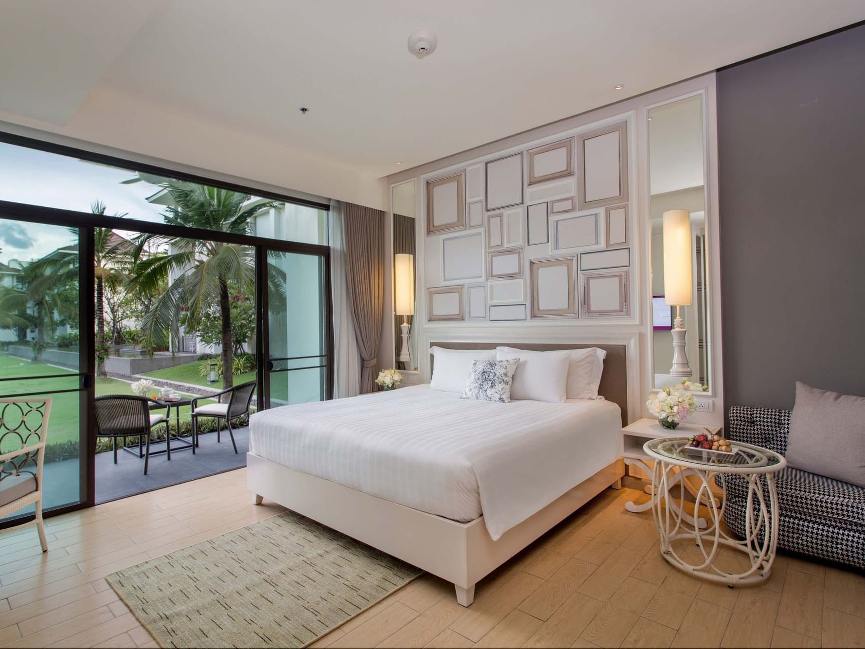 Terrace garden view room with white sheeted bed at U Hotels