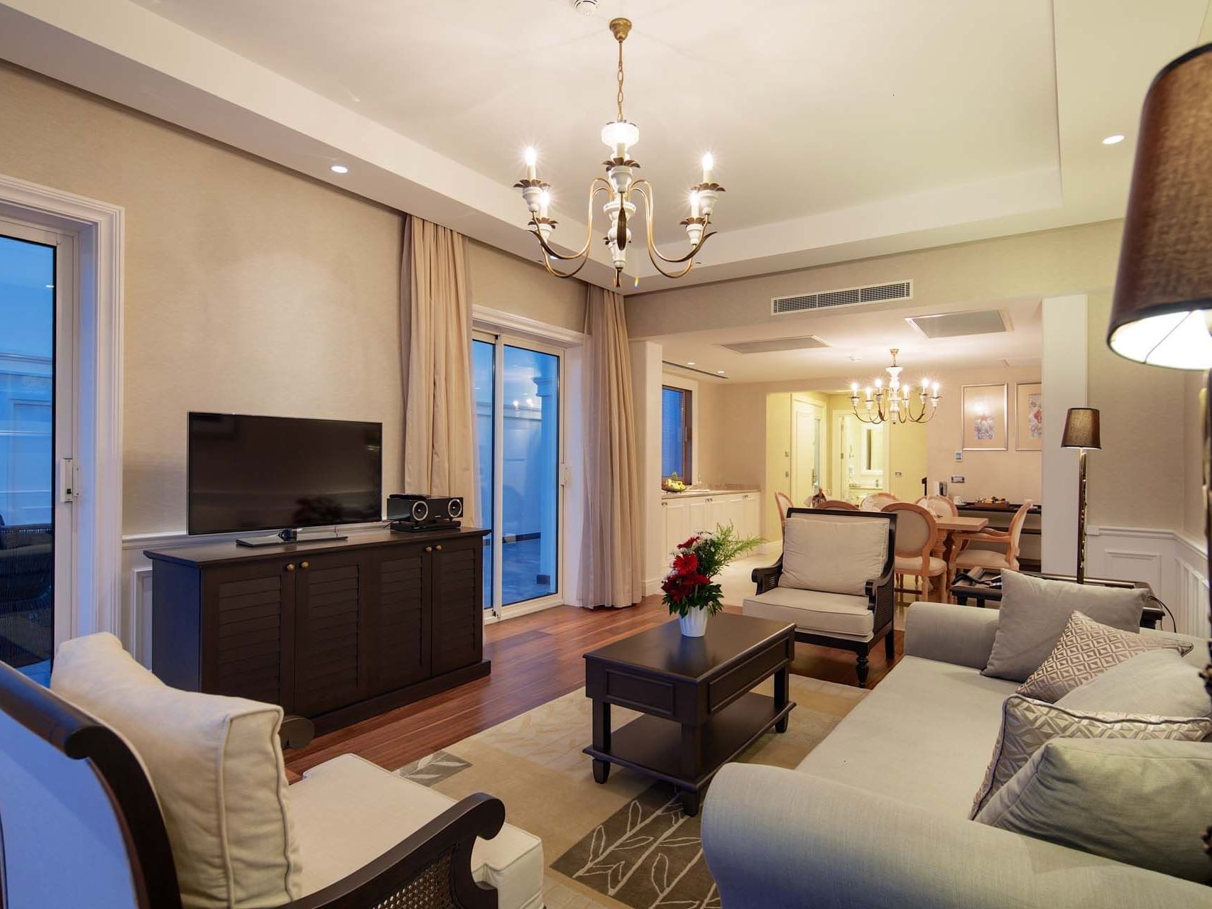 TV lounge area in Design Pool Villa with wooden floors at Titanic Deluxe Golf Belek