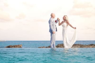 Wedded couple by outdoor pool, The Morgan Resort Spa Village