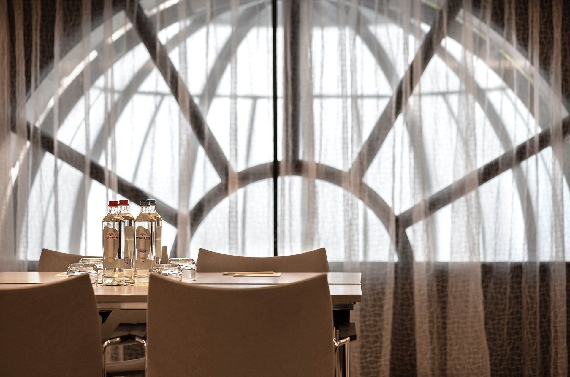 Barsey II event room with table and chairs in front of a large window at Hotel Barsey by Warwick in Brussels