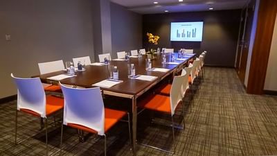 Boardroom set for meeting at The Godfrey Boston Hotel