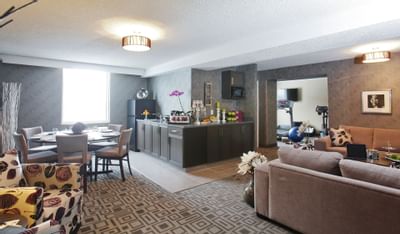couches and a kitchen area in a hotel room