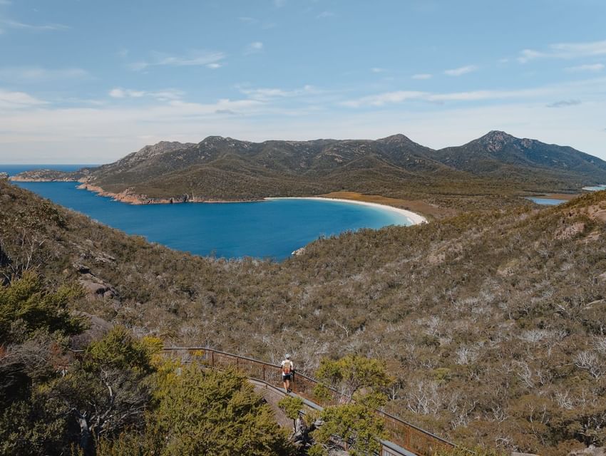 Aerial view of Wineglass Bay on a sunny day near Freycinet Lodge
