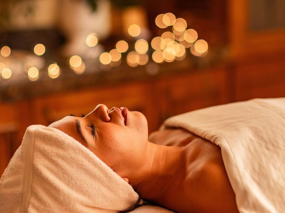 Woman laying down on spa treatment table