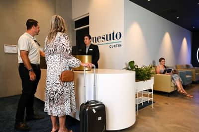 Guests checking in by the reception, Nesuto Curtin Perth Hotel