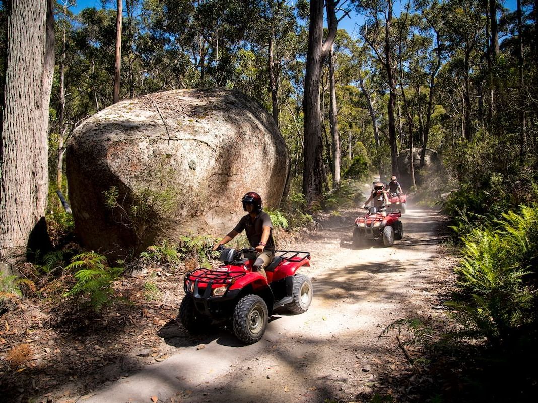 People riding on quad bikes at Freycinet Lodge