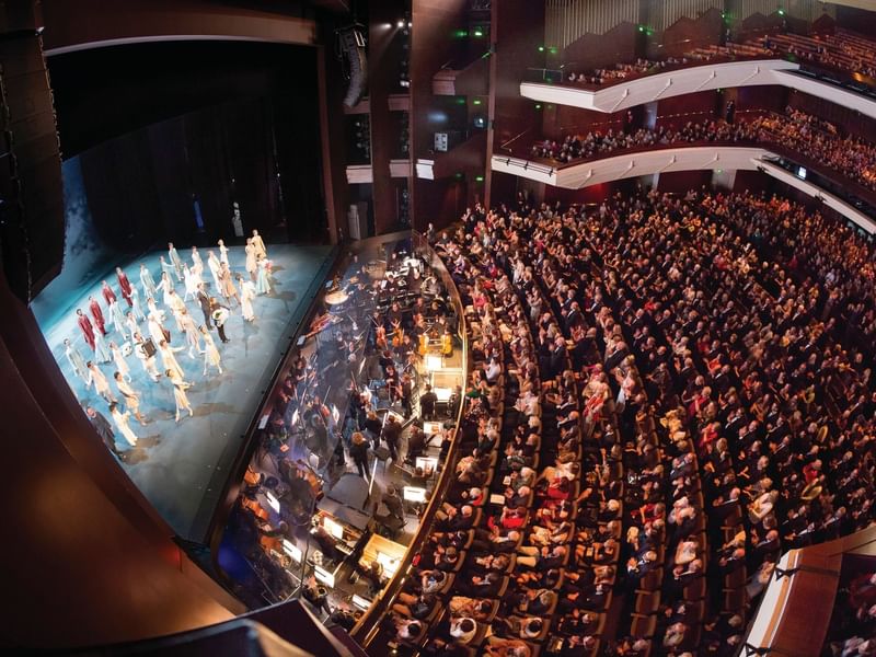 Theater with audience watches a performance at Queensland Performing Arts Centre near Sofitel Brisbane Central