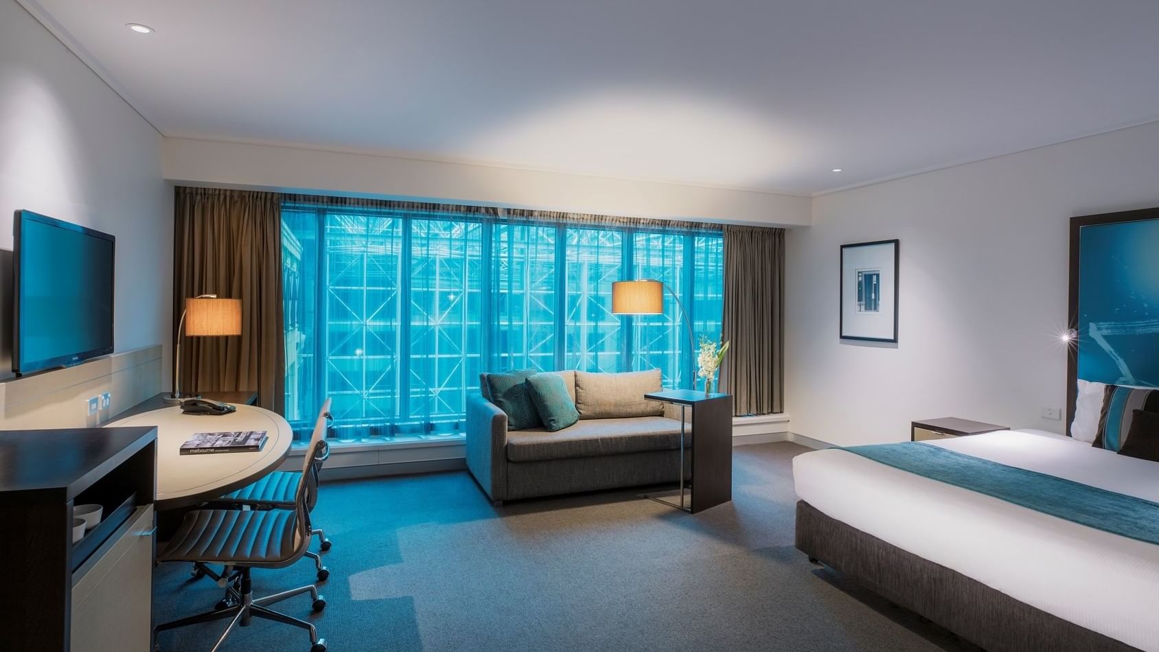 Interior of Family Suite with king bed at Novotel Melbourne