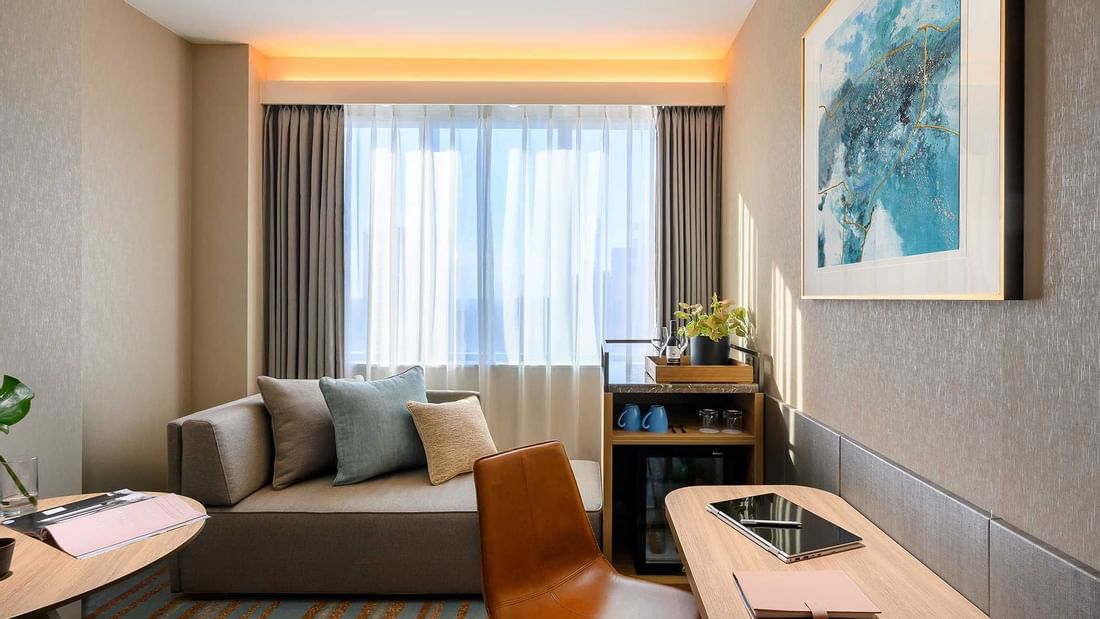 Working desk, sofa in Superior Room at Melbourne Central Hotels